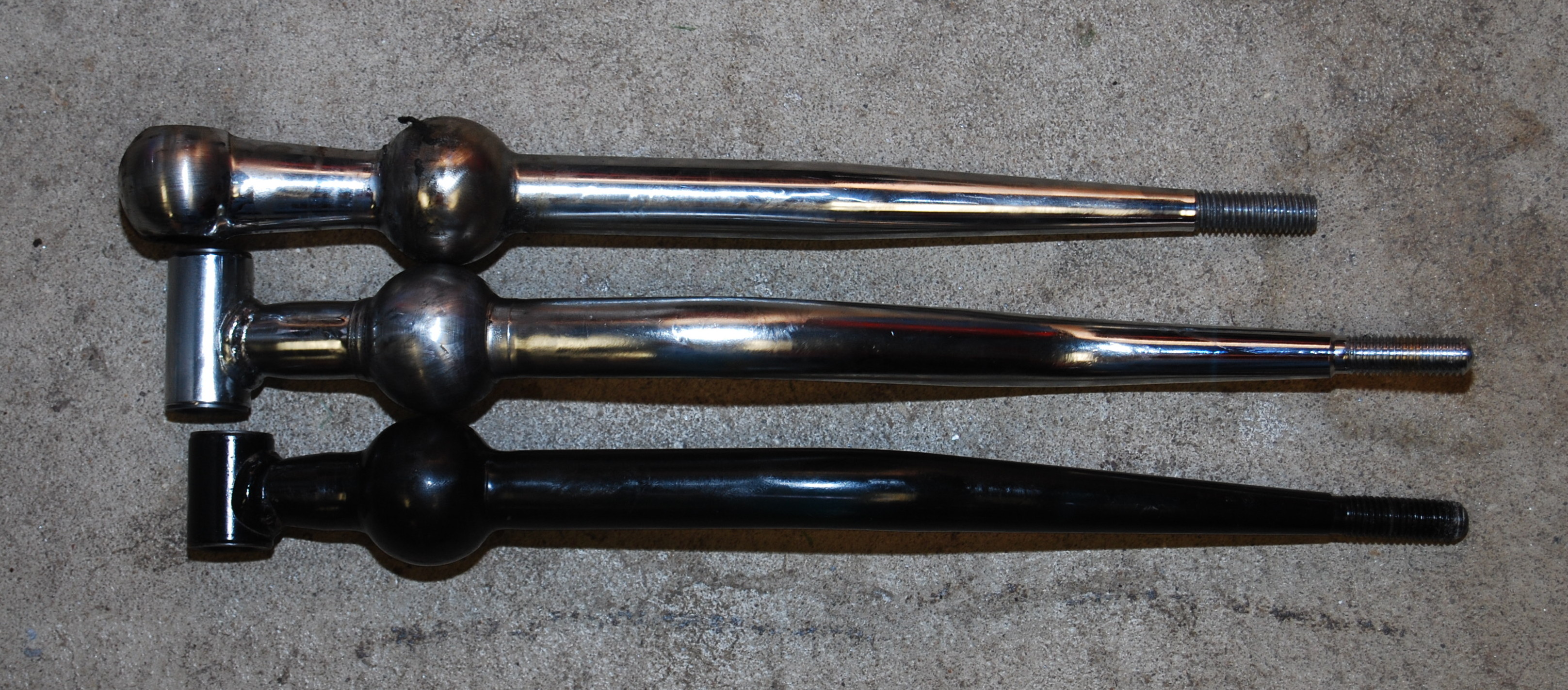 From top to bottom:  B&M, OEM Integra, OEM Civic.  The chromed OEM shifter came in later versions of the Integra.  Earlier versions of the shifter were black.  