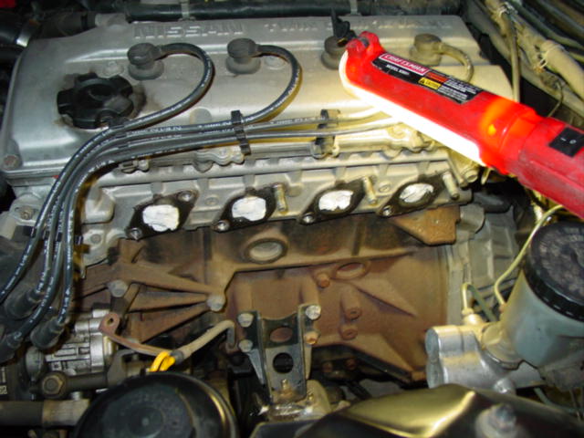 With the manifold out of the way, you will need to clean off the original gasket material. I would take a moment and stuff the ports with paper towel so that you do not get any gasket material inside the engine. 