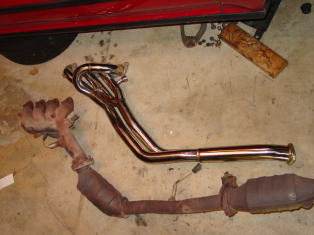 For my swap, I used an OBX header that I bought on eBay. It was $200 shipped. Other than hitting the bottom of the car, due to my Nismo mounts, it's an excellent solid stainless steel manifold.