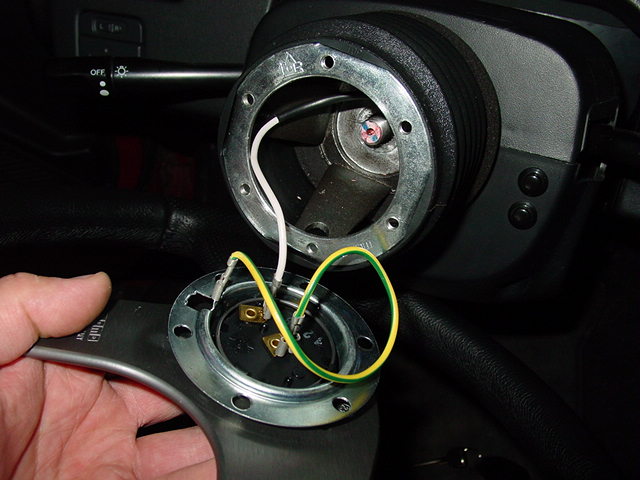Once you center the hub, you can attach the steering wheel. Wire the horn according to the manufacturer's instructions.