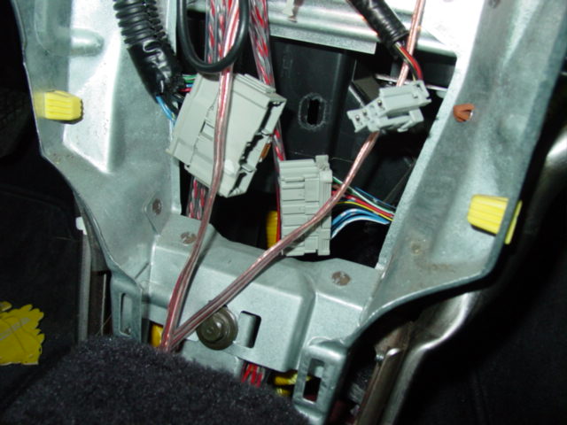 Once you have the console out of the way, you will see a large harness plug. This is the wiring for the climate control. It needs to be disconnected just as I've shown in the picture.