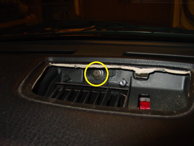 With the top vent out of the way, you can remove the single bolt that you will find.