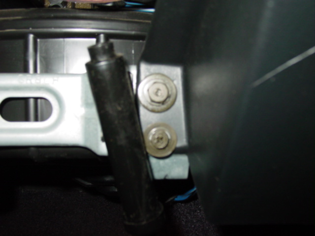 Remove two screws on the right of the glove box opening.