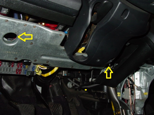 Remove the plastic cover under the steering column by removing three screws, two on the left and one on the right. 