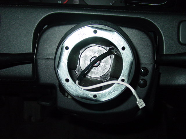 Install the hub. You may need to use trial and error to determine the center position of the steering wheel. Do this in a parking lot or somewhere else away from traffic.